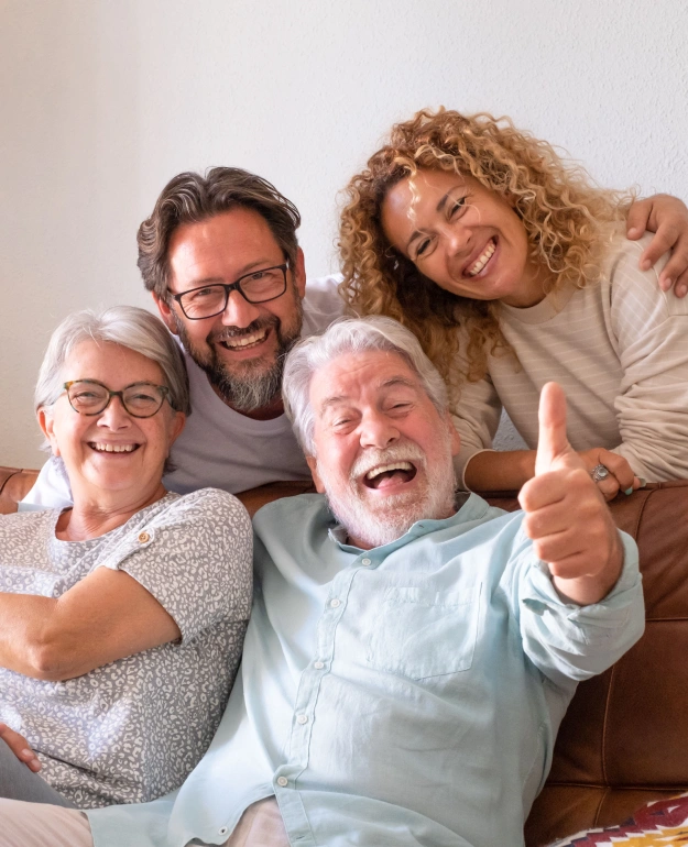 Multi-generational family smiling together after receiving comprehensive dental care at Cariboo Choice Dental in Williams Lake, BC